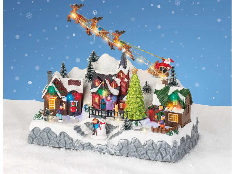 Scenografia Natalizia Luminosa LED di Babbo Natale Santa Claus 14x21x19cm H con Scenografia e Luci Multicolori Colours Multi | Kaemingk